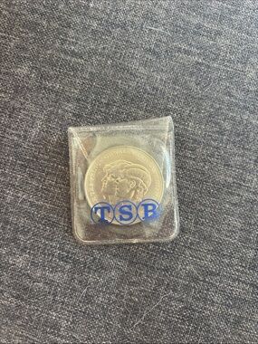 The prince of wales and lady Diana coin with Elizabeth the second on the back